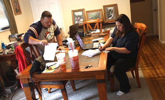 Family pays bills at their home in Colorado.